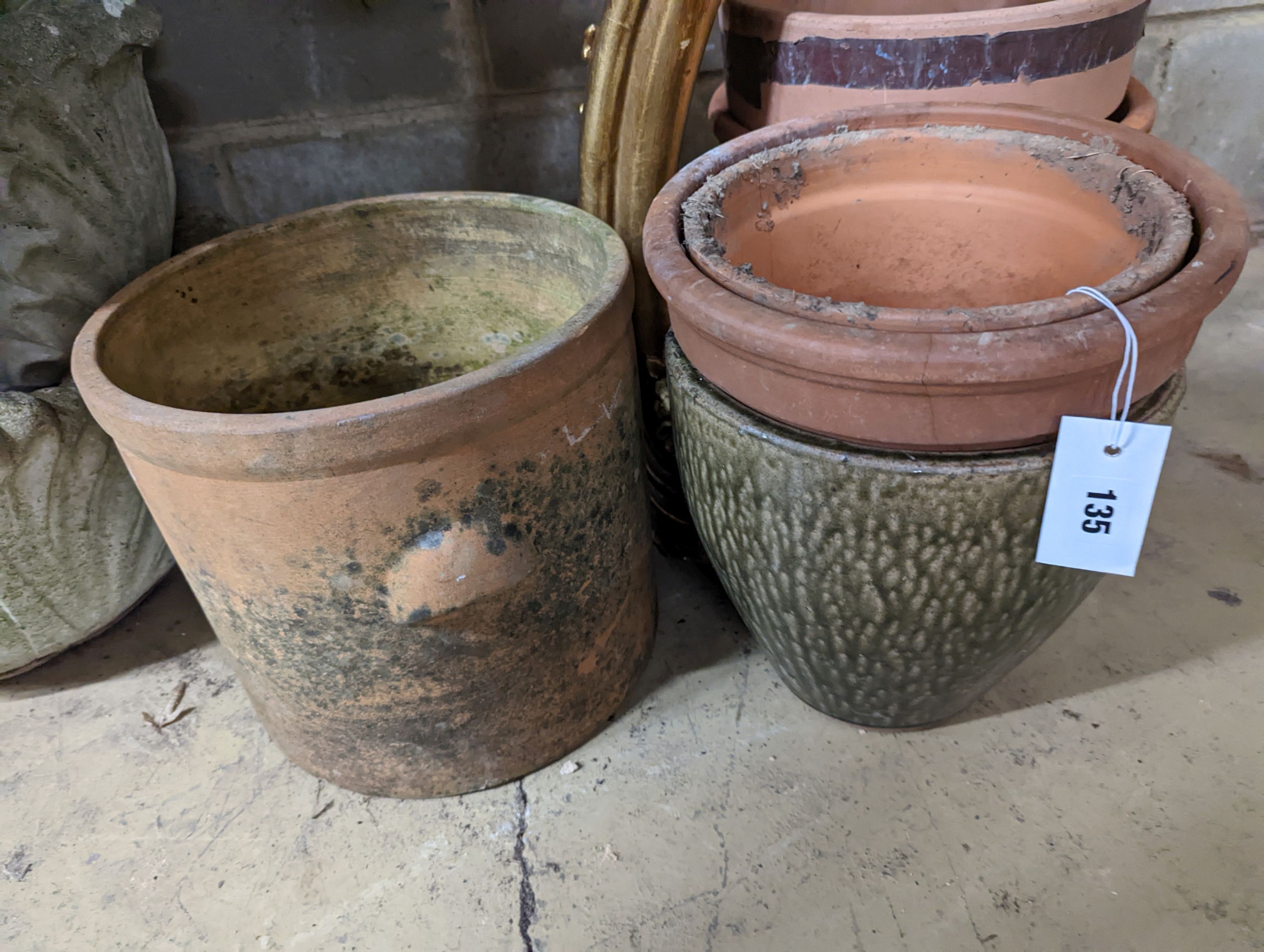 Seven assorted earthenware garden planters, largest 28cm diameter